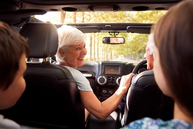 woman-driving-grandkids